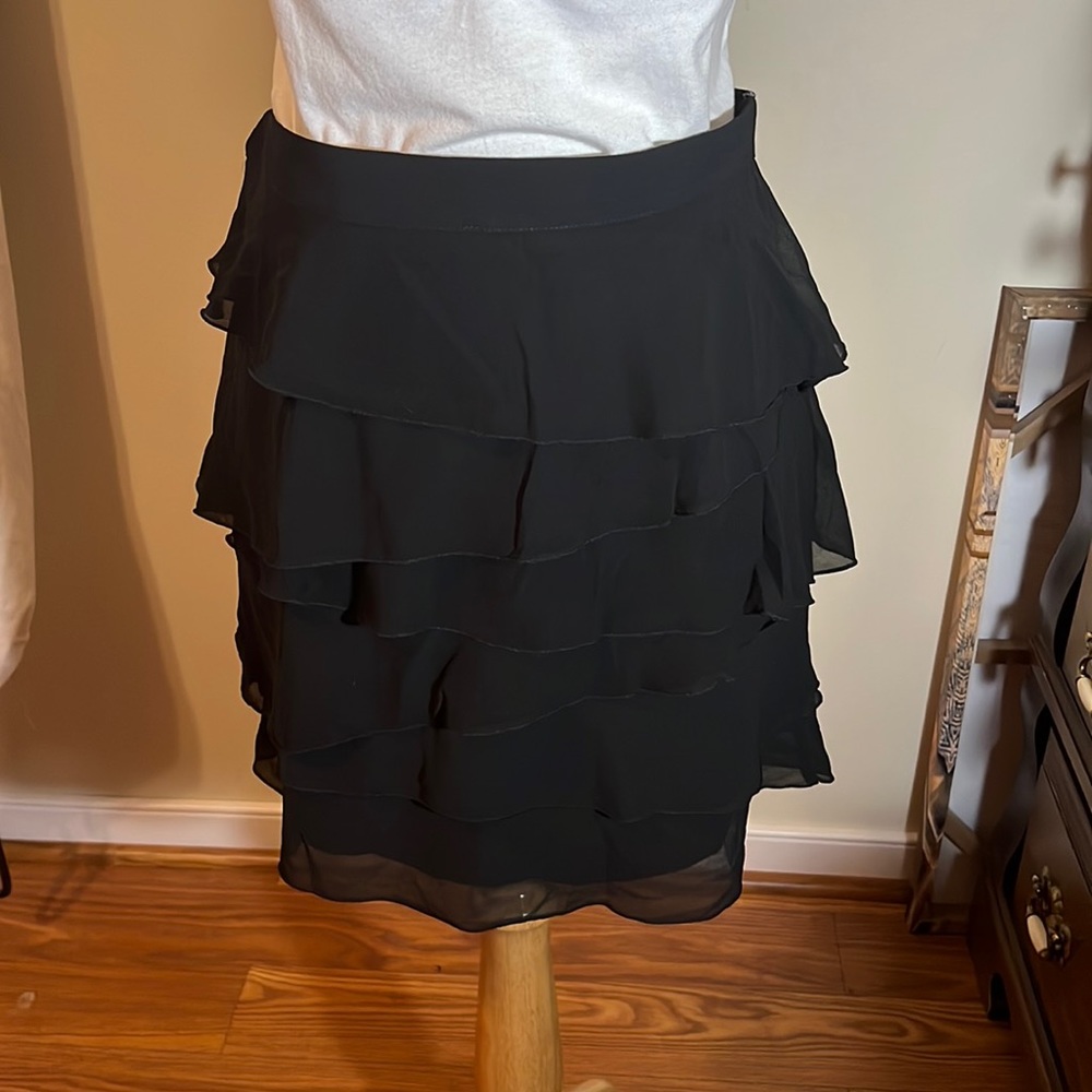 Black ruffled skirt with side button and zipper closure